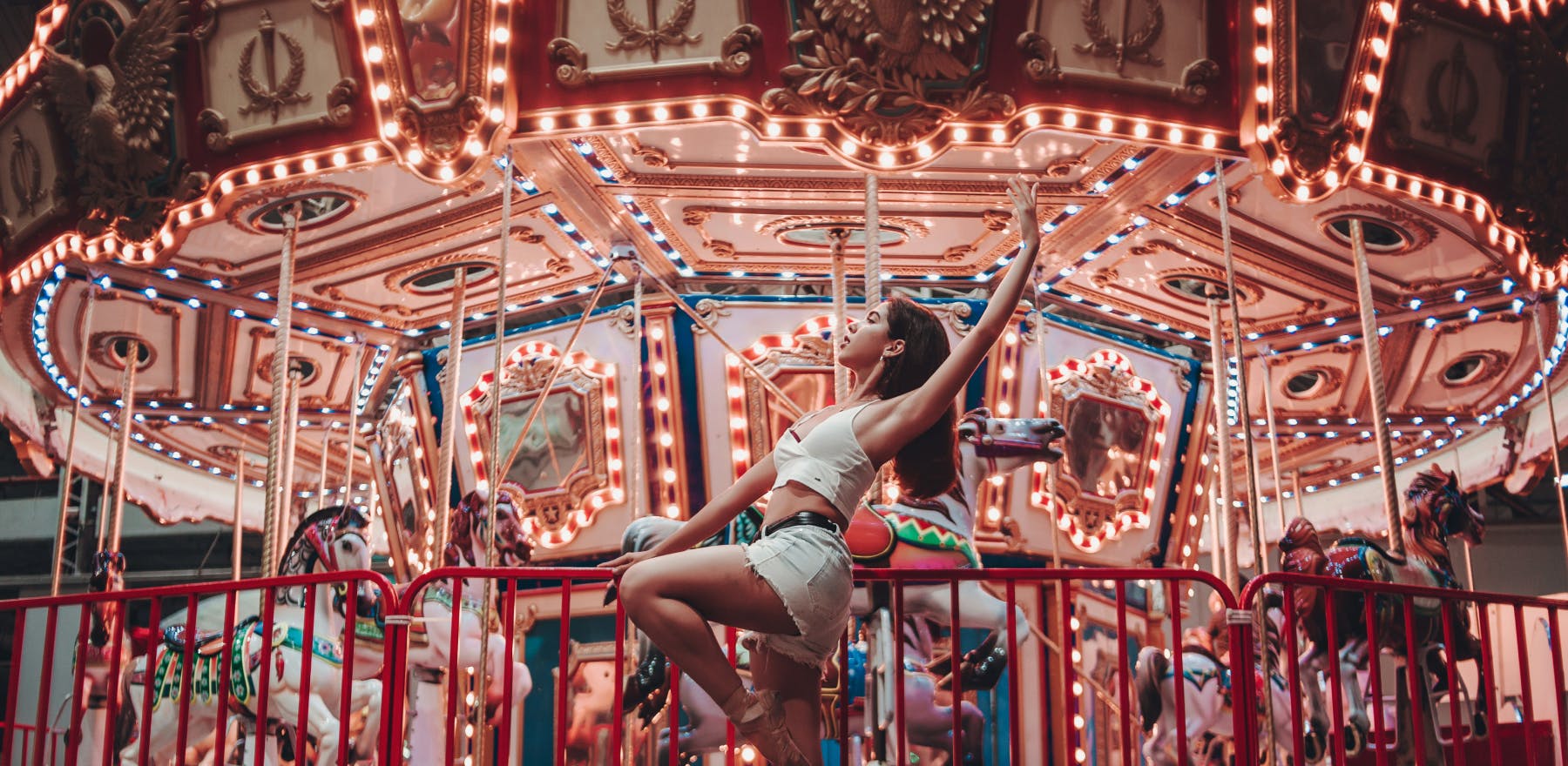 Dancer in front of carousel image