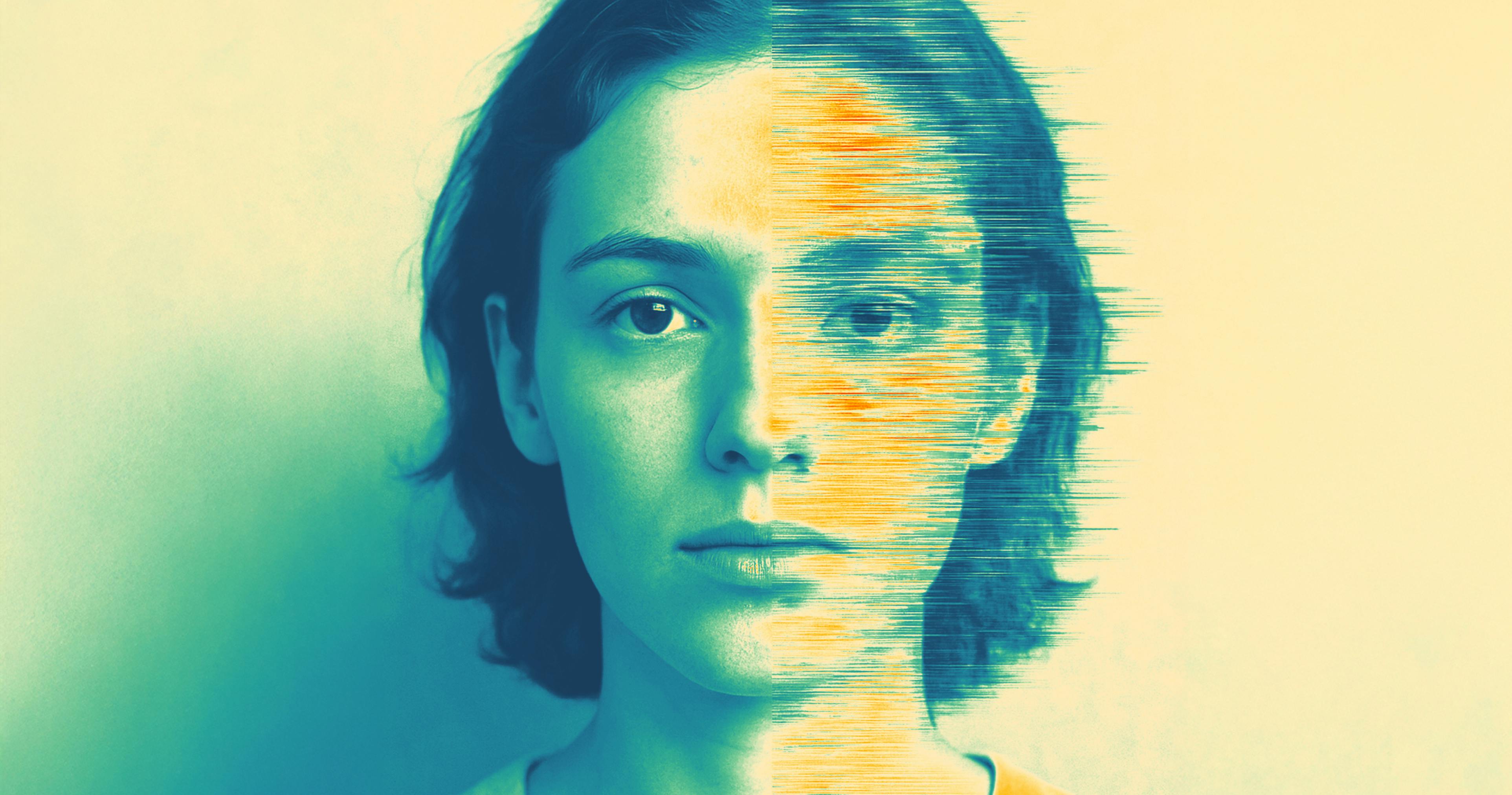 woman looking into camera with right half of face slightly blurred